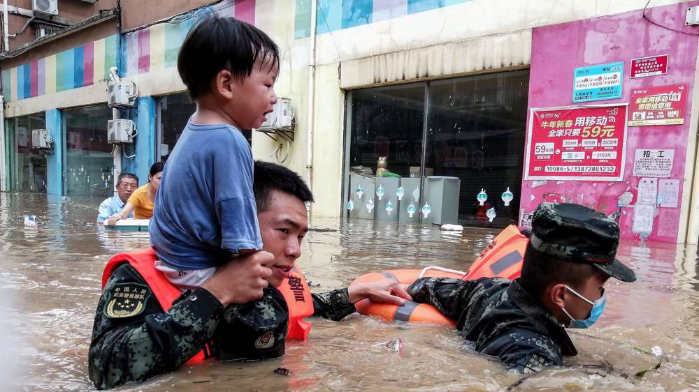 China, Japan cities declare 'red alerts' as flood death toll rises