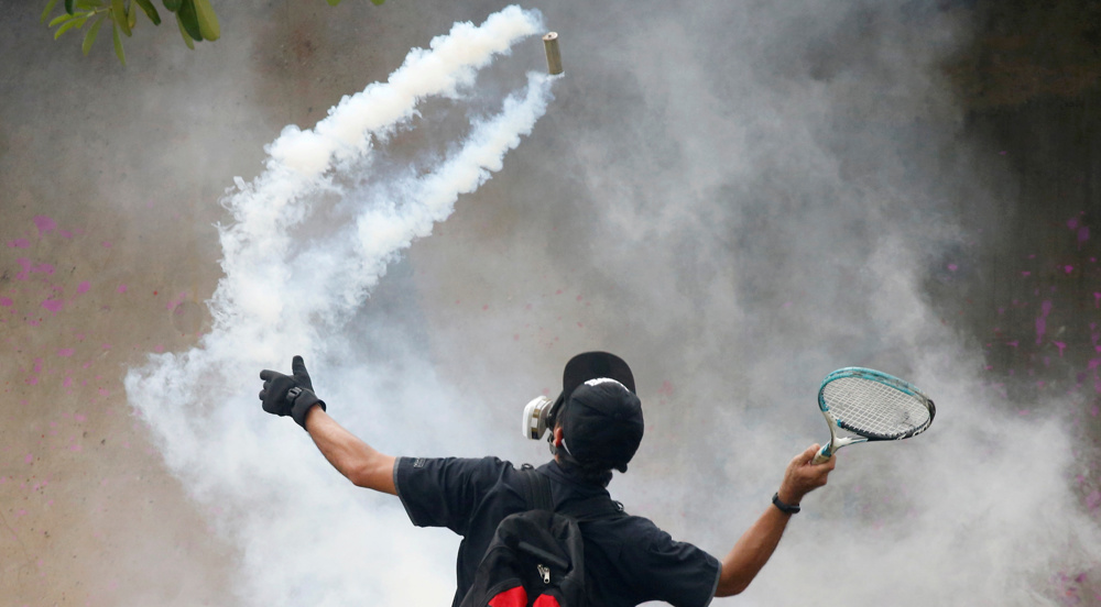 Police fire tear gas at anti-government protesters in Bangkok 