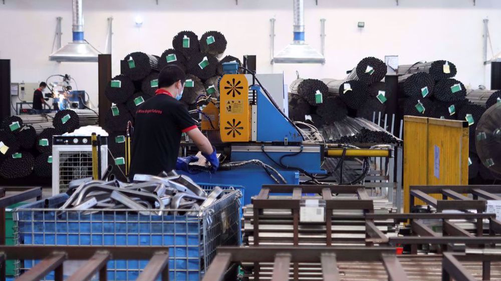 China economy under pressure as factory output, retail sales growth slow sharply