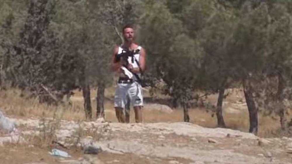 Watch Israeli settler opening fire at Palestinians with soldier's rifle
