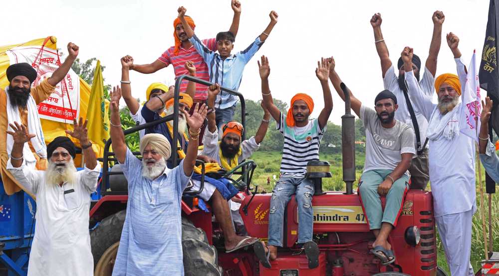 Indian farmers rally to protest farm laws, police brutality