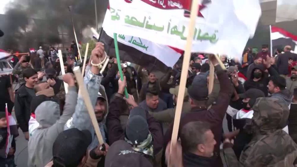 Iraqis rally ahead of anniv. of US assassination of Gen. Soleimani, burn model of US embassy