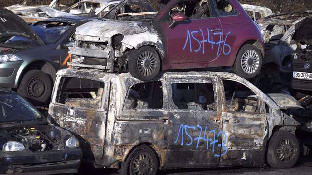 874 cars set ablaze across France on New Year's Eve