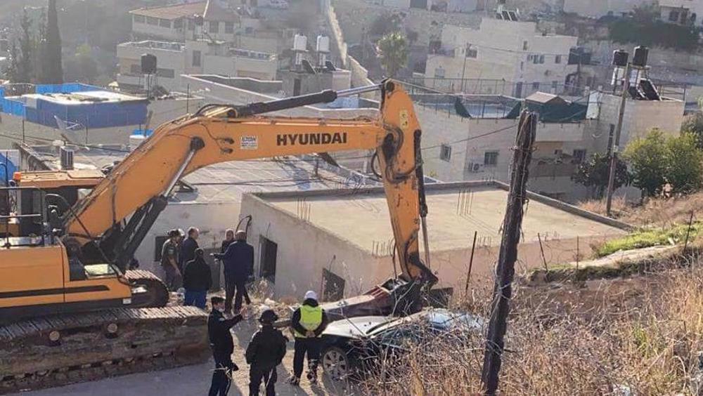Israel forces two Palestinians to raze their home, store in al-Quds