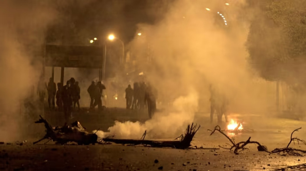 Tunisia protests: Police fire tear gas at protesters during second night of clashes
