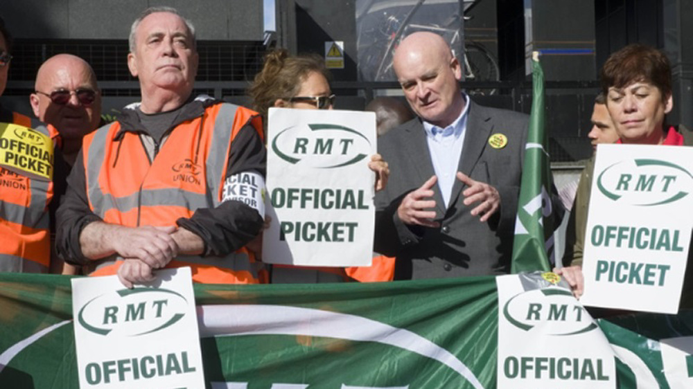 UK's rail union to stage three days of strikes next month