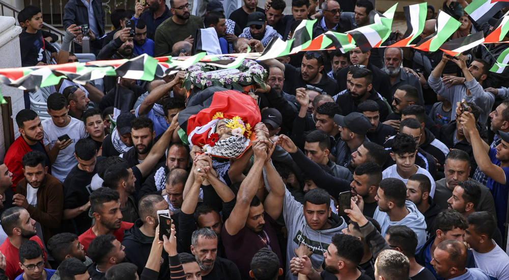 Palestinians hold massive funeral for teen killed by Israeli forces in West Bank attack