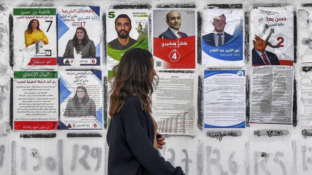 Tunisians vote in parliamentary elections marred by mass boycott threats 