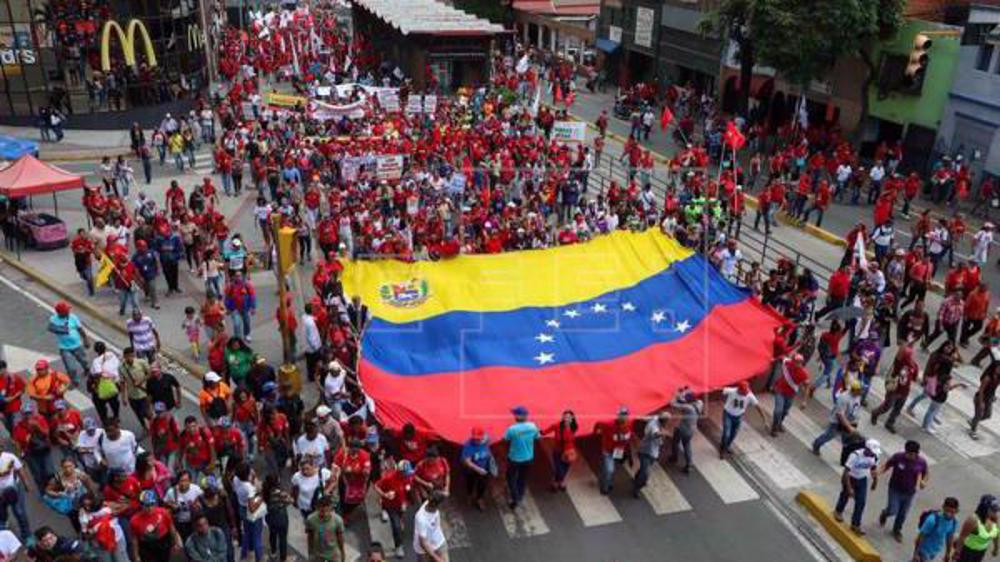 Thousands of Venezuelans march in support of President Maduro