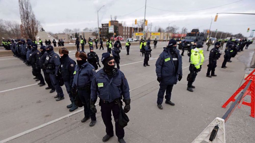 Key US-Canada border bridge remains closed as Canadian police clear protesters