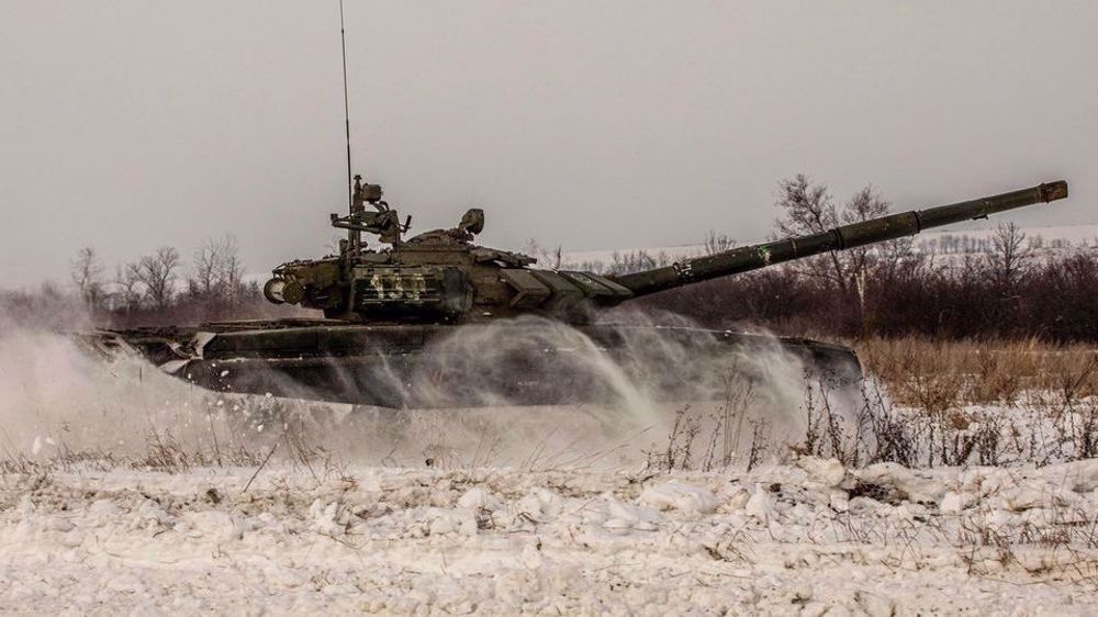 Some Russian troops return from Ukraine border in a sign of de-escalation