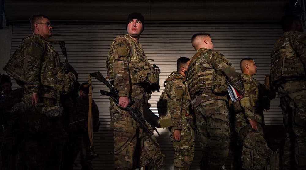 5,000 US troops arrive in Poland as Biden warns of high risk of Russia invasion