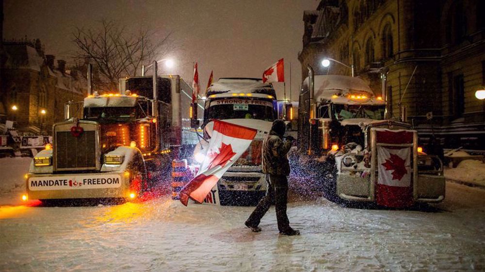 Scuffles break out as Canada police tow trucks, arrest truckers