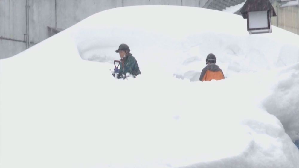 Heavy snow sweeps northern Japan causing disruptions to local transportation systems