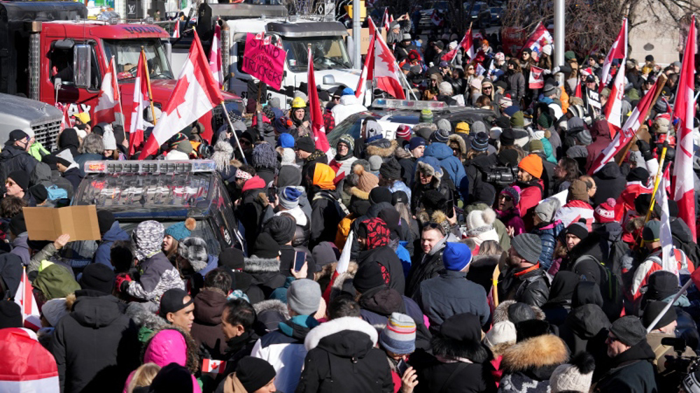 Canadian protesters in Toronto demonstrate against COVID restrictions