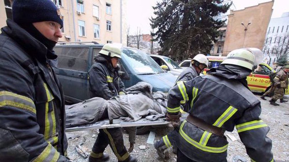 Ukrainian rescuers working among debris following alleged air strike