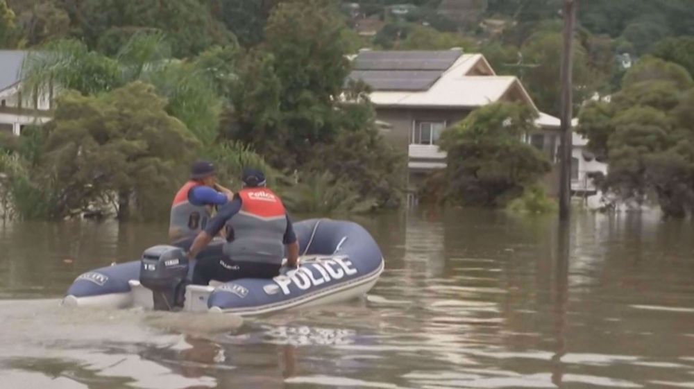 Houses, streets flooded in Australia, forcing people to take shelter