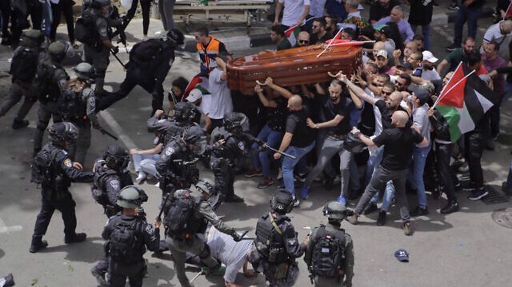 Al-Quds archbishop, Christian churches condemn Israeli forces' attack on journalist's funeral