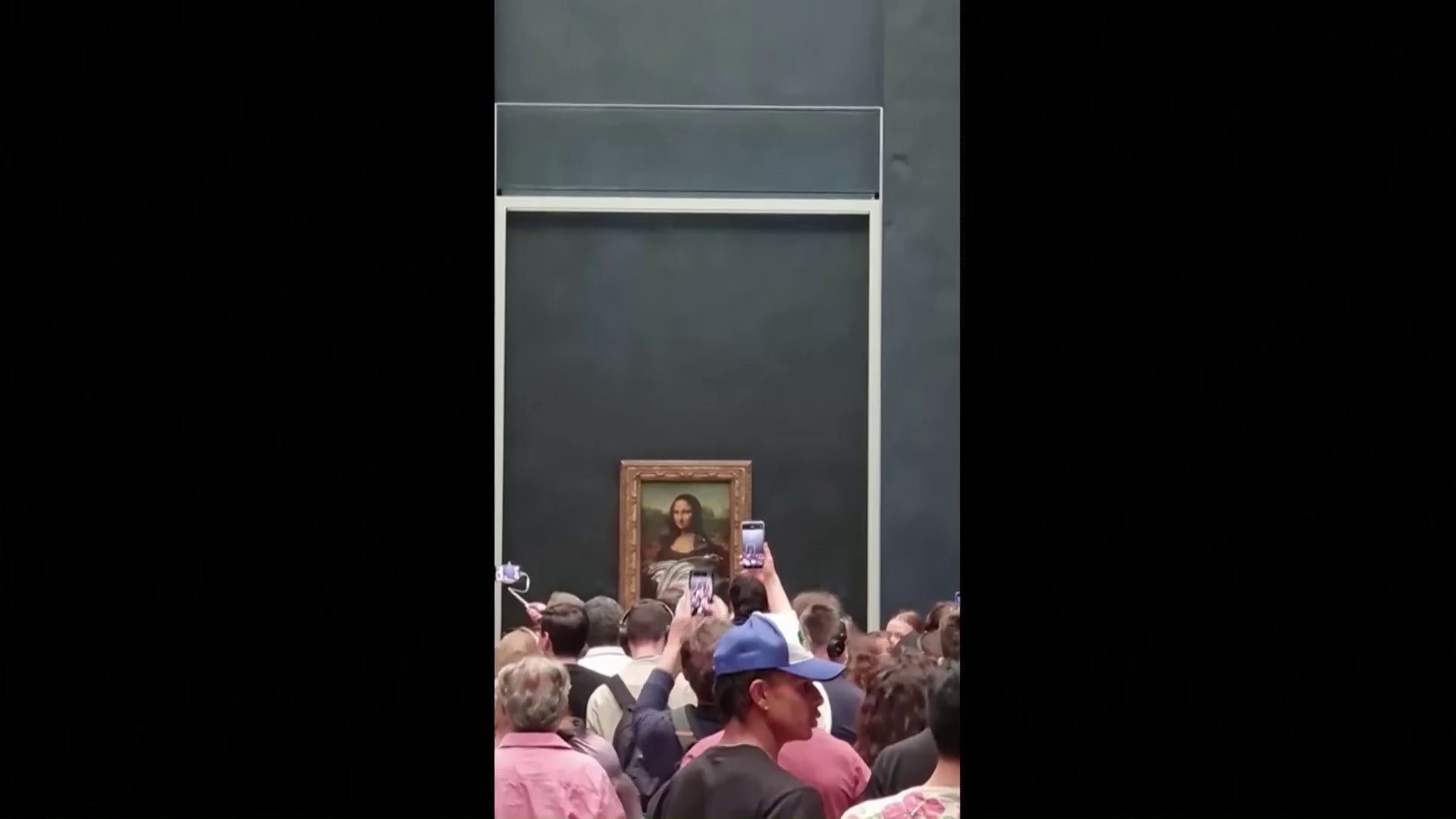 Mona Lisa smeared in cream in climate protest attack
