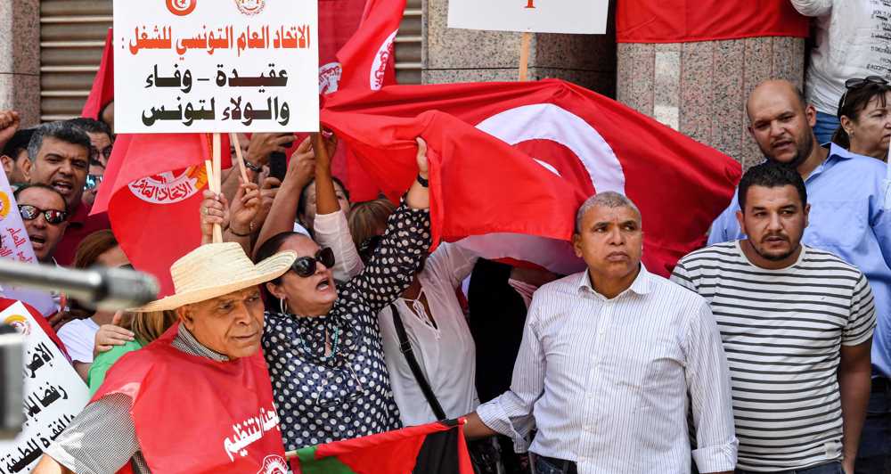 Thousands take to streets to protest Tunisian president’s bid to overhaul constitution