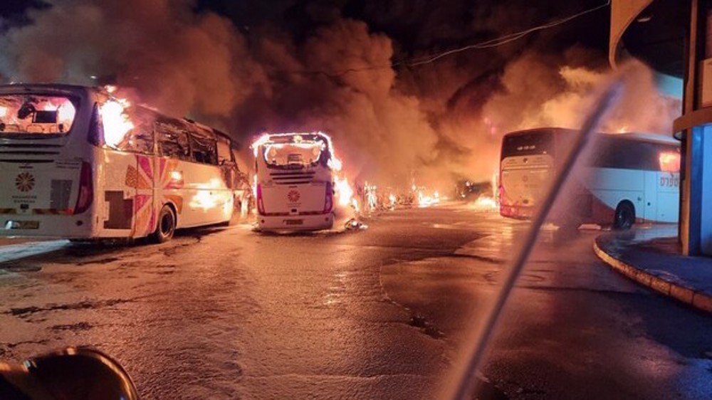 Two buses torched at parking lot in Israeli-occupied territories south of Tel Aviv