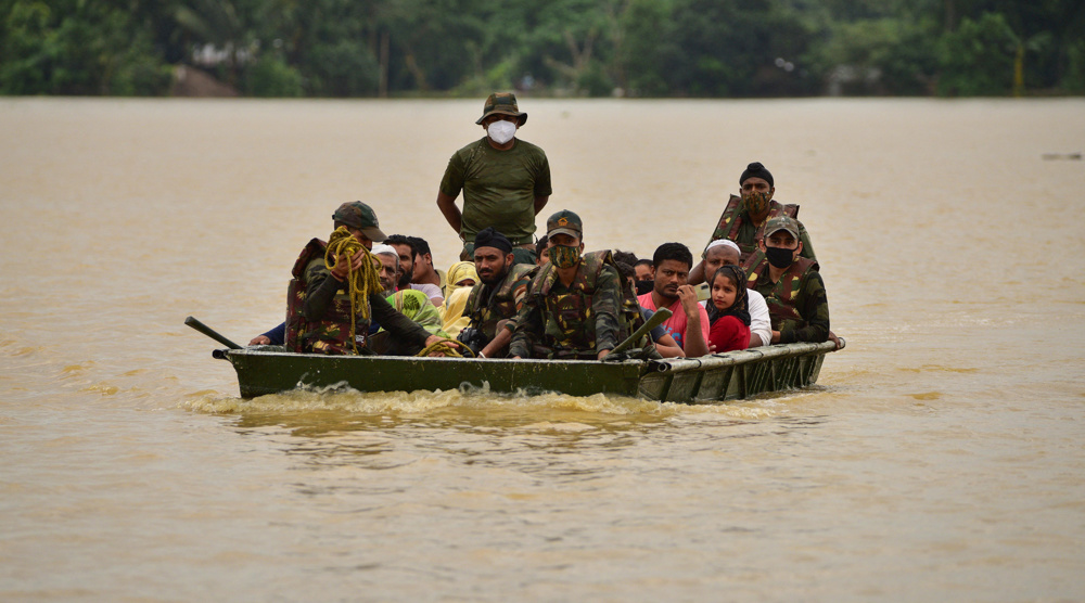 India's Assam struggles with floodwaters, rescuers help stranded people