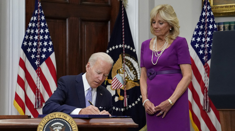 Biden signs gun safety bill into law, slams Supreme Court