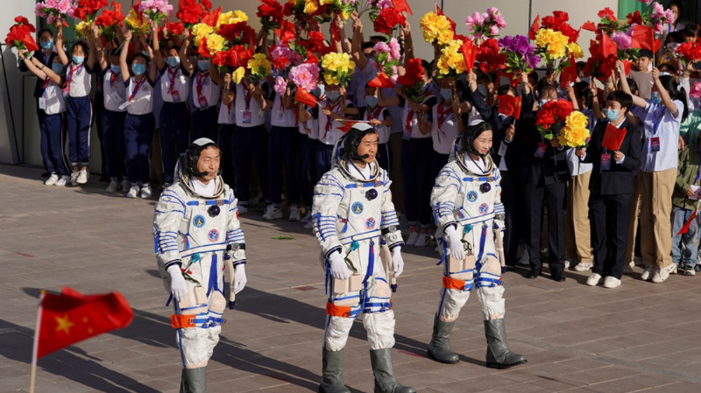 China sends three astronauts to complete space station