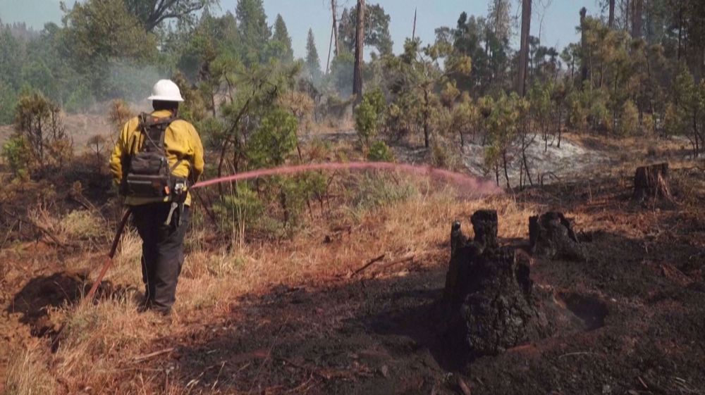 Firefighters tackle California wildfire as heat grips parts of US