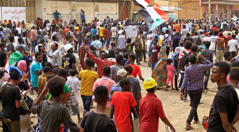 Protesters in Sudan demand end to military rule, deadly tribal clashes