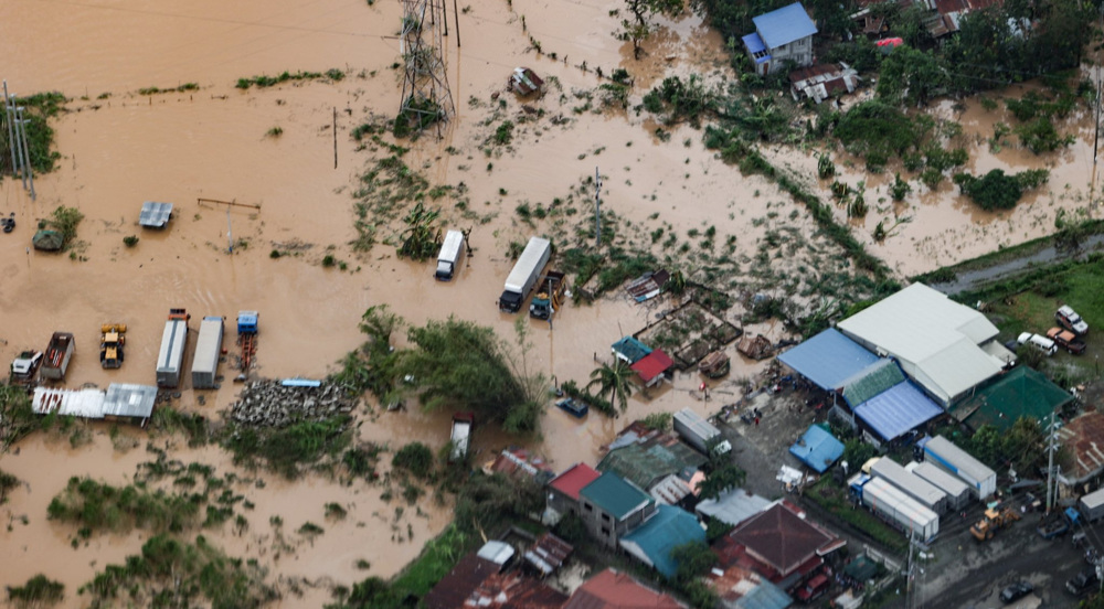 Heavy rains from Typhoon Noru flood houses in northern Philippines
