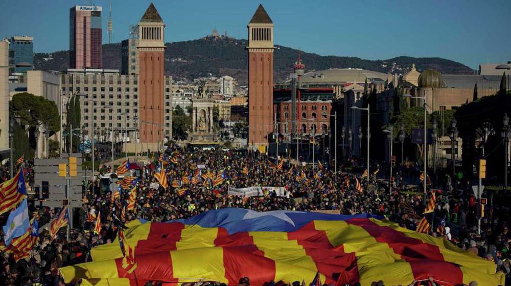 Pro-independence Catalans in Barcelona greet France’s Macron with protest