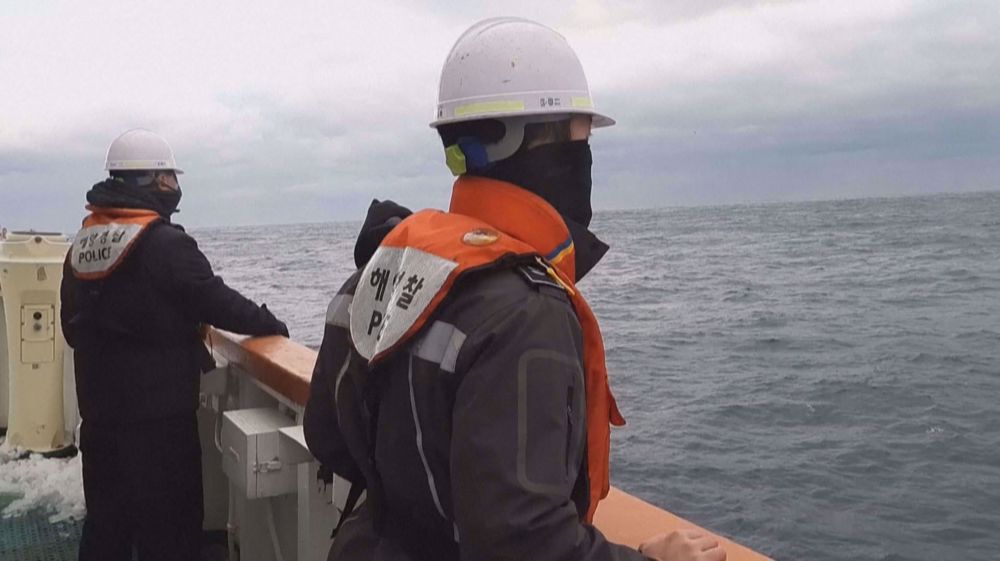 Thirteen crew rescued after ship capsizes off Japan, search on for 9 missing