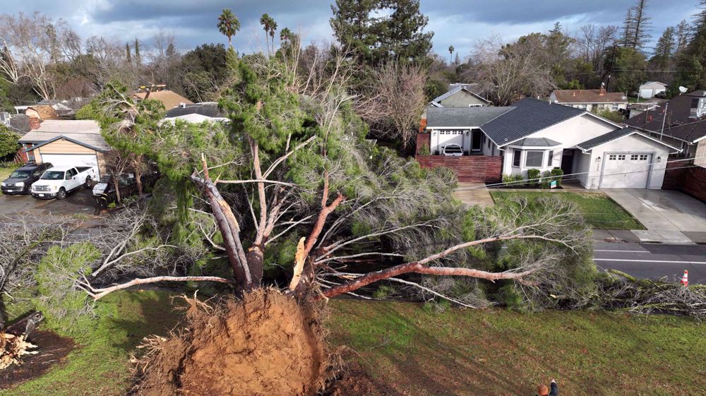 California braces for 'parade of cyclones' after storms kill 12