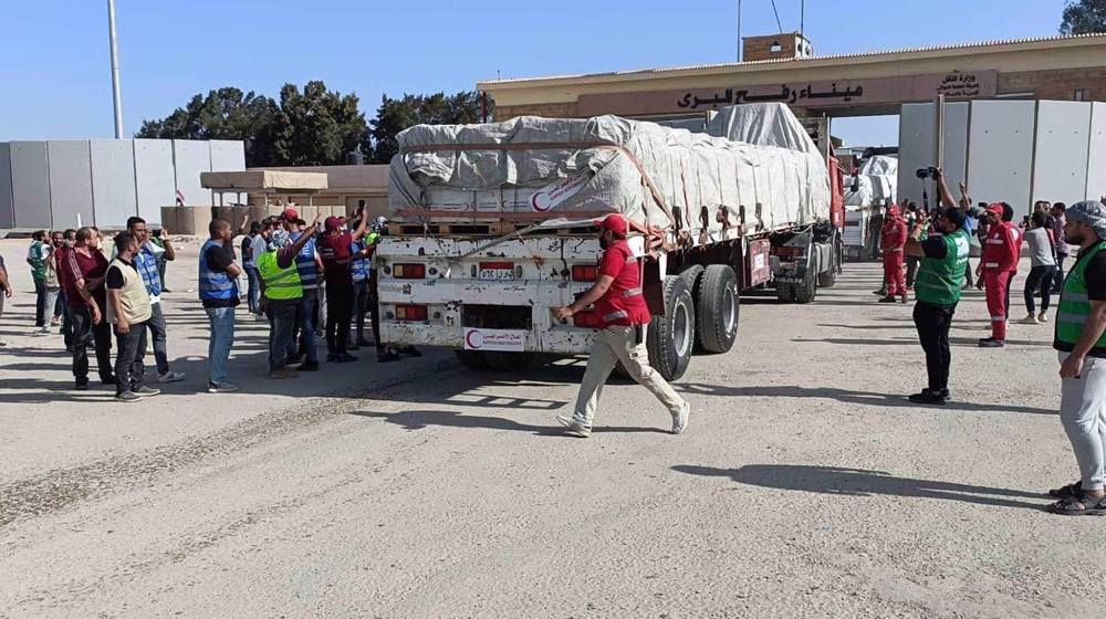 Hamas calls for permanent corridor as aid trucks enter Gaza for first time since carnage