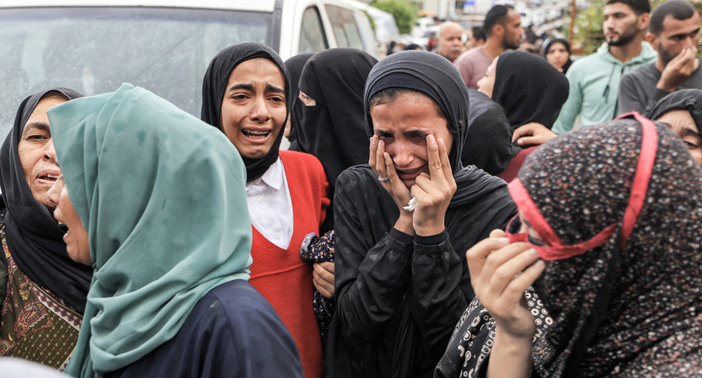 Gazans hold mass funeral for family members killed in Israeli airstrike