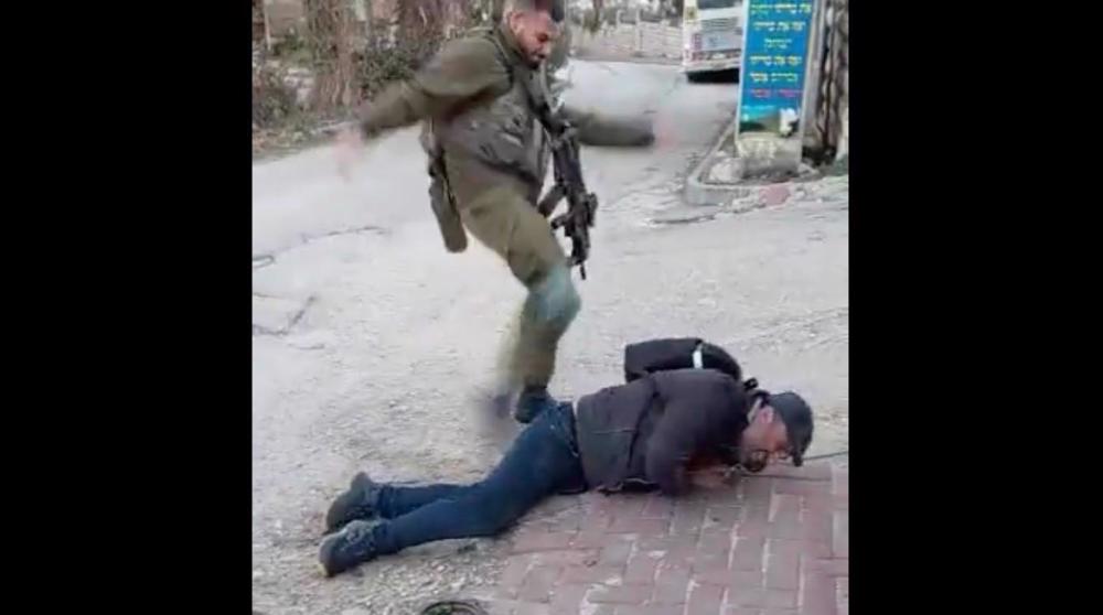 Israeli soldier filmed assaulting Palestinian activist in occupied West Bank 