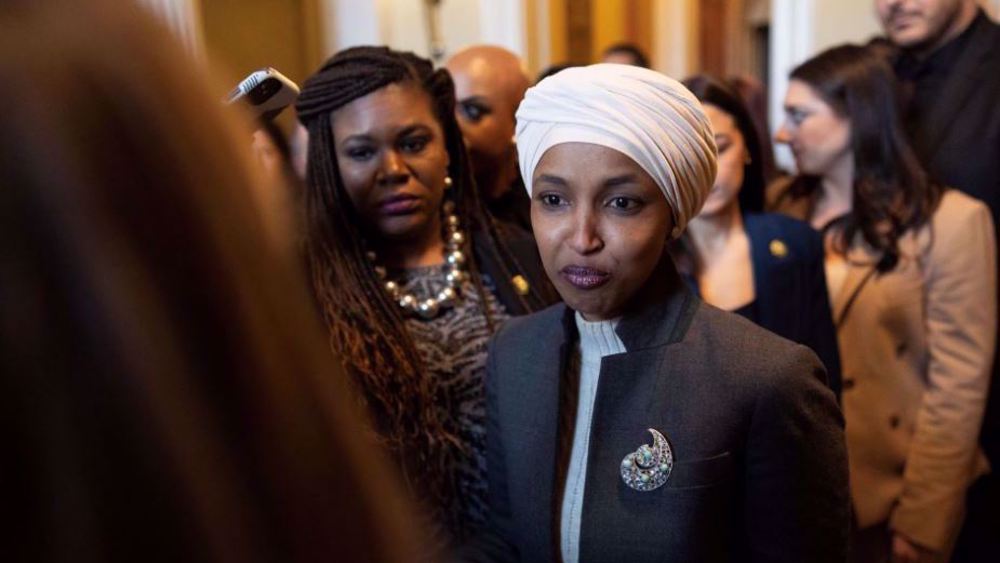 US Rep. Ilhan Omar (D-MN) (L) talks with Speaker of the House Nancy Pelosi (D-CA) during a rally with fellow Democrats before voting on H.R. 1, or the People Act, on the East Steps of the US Capitol on March 08, 2019 in Washington, DC. (AFP photo) 