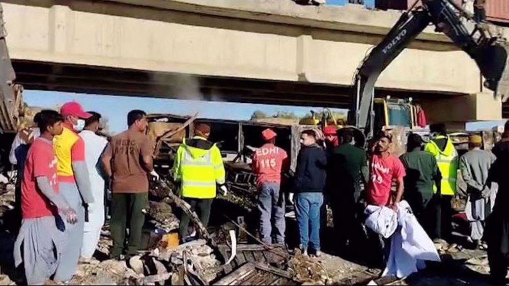 Dozens dead after bus collides with car, falls into ravine in Pakistan