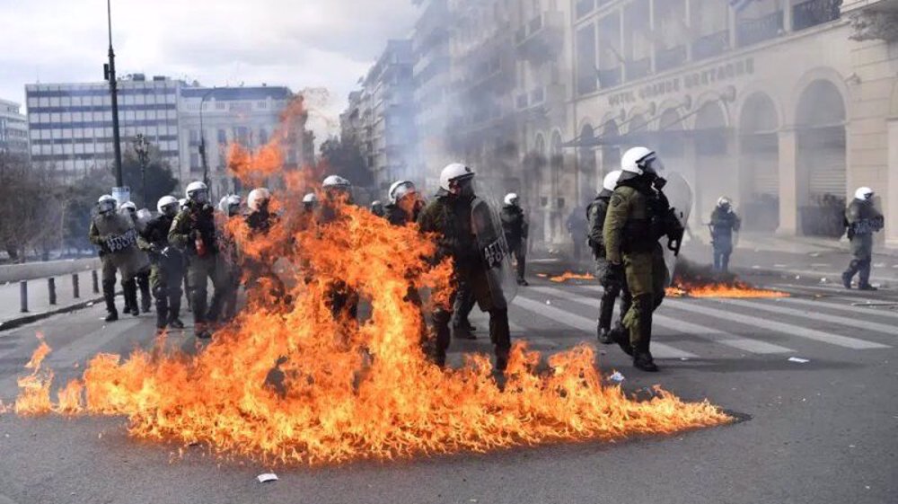 Police, protesters clash over rail crash in Greece