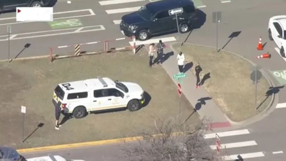 US student on run after shooting two school staff