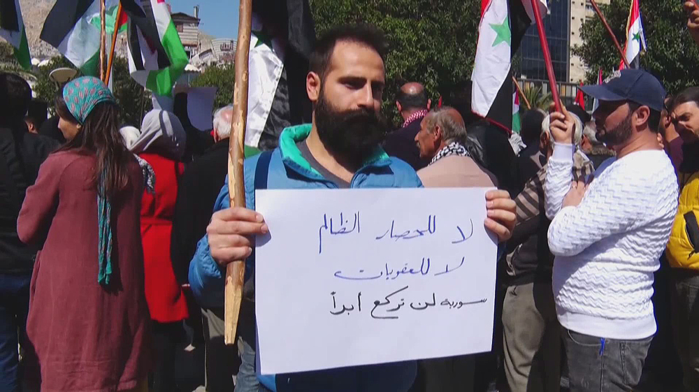 Syrian protesters call for removal of US sanctions