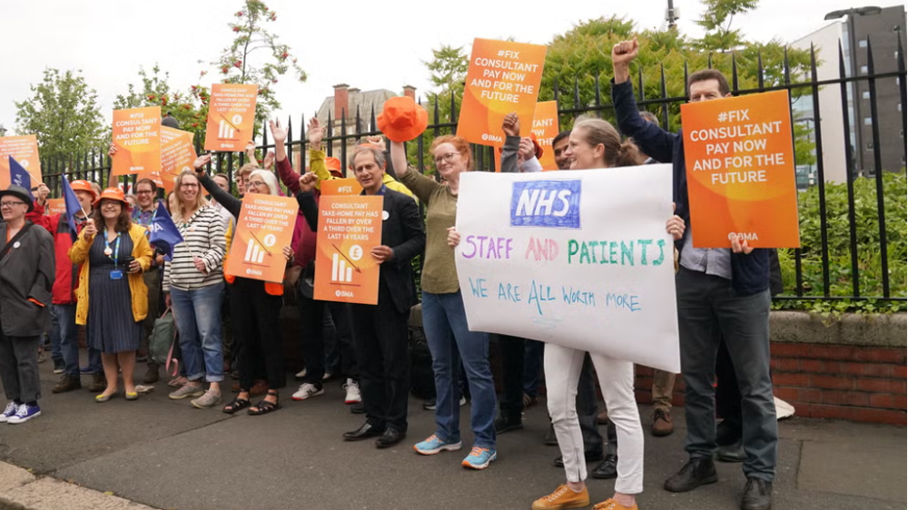 Senior doctors in England stage first major walkout in decade, reject pay deal