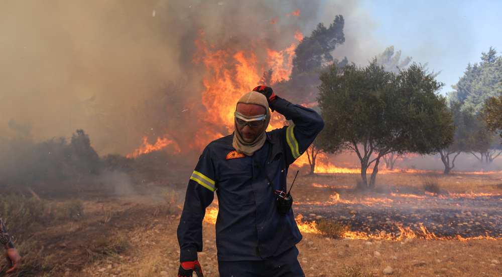 Mediterranean gripped by wildfires, dozens killed 
