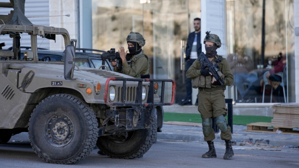 Israeli forces raid West Bank town, injure dozens of Palestinians