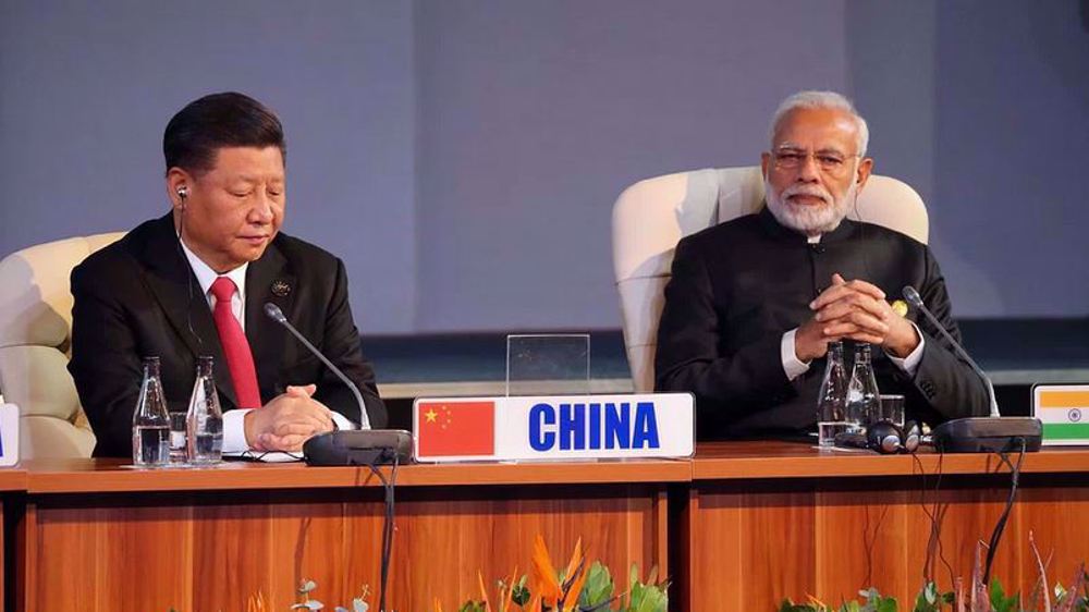 XI, Modi hold rare talks on shared interests amid BRICS summit