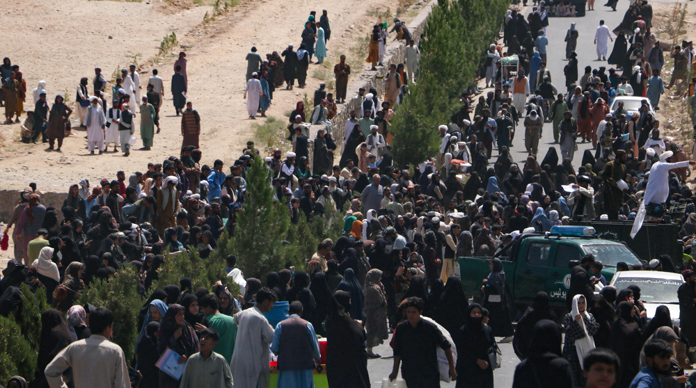 Thousands of Afghans rush to passport office in Herat 