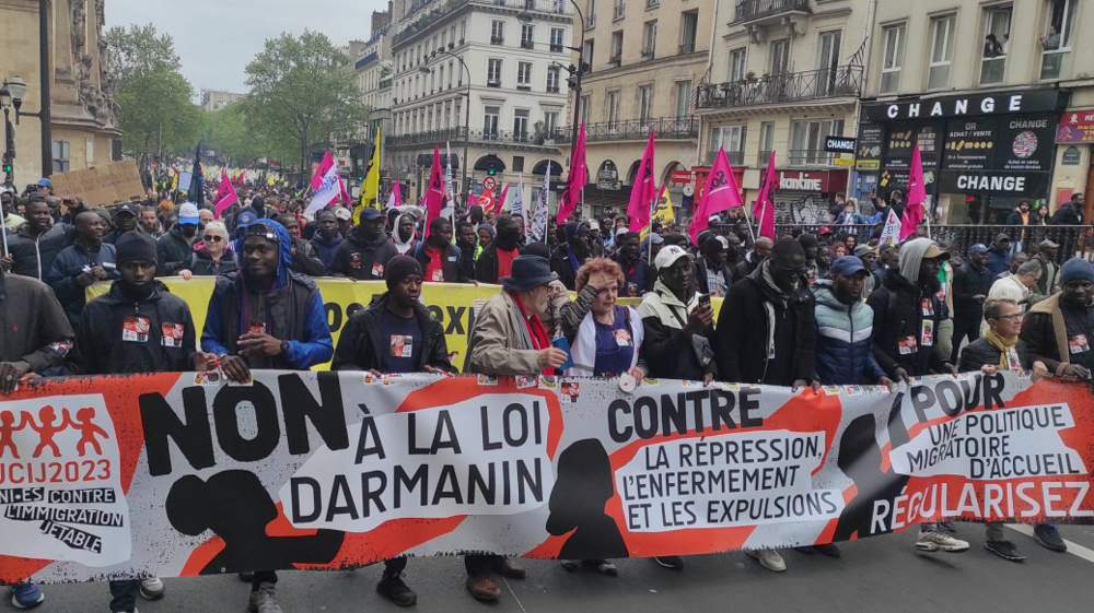 Thousands rally in Paris against new draft of immigration law
