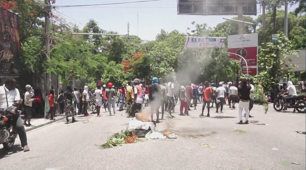 Haitians set police, gov't vehicles on fire to demand protection from gangs