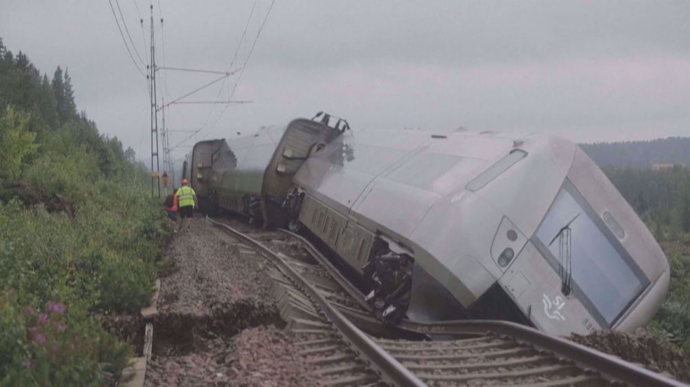 Images show floods and derailed train following heavy rains in Sweden